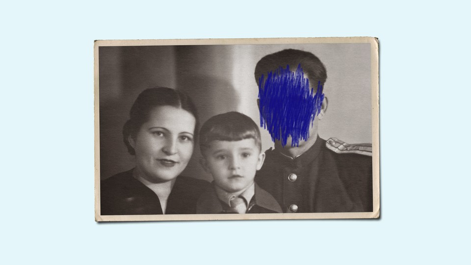 A family photograph with one person's face crossed out