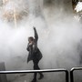 Students attend a protest at Tehran University, where a smoke grenade was thrown by anti-riot Iranian police on December 30, 2017.