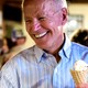 Biden grinning as he holds an ice-cream cone
