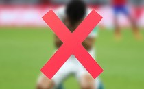 A giant red X illustrated over a blurry photo of a soccer player