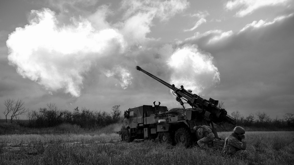 A Ukrainian artillery battery fires at Russian lines.