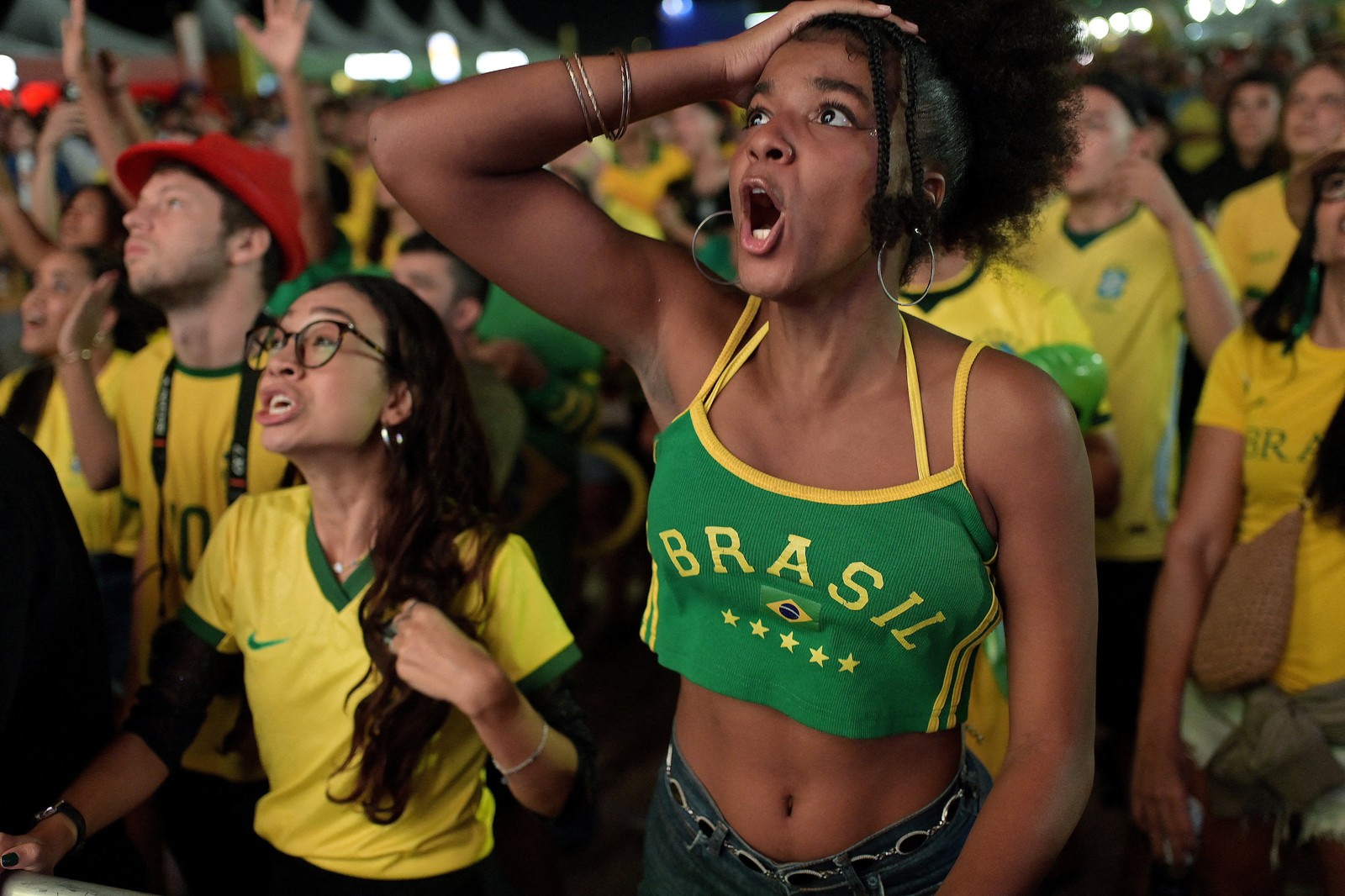 Team Brazil fans react during a watch party.