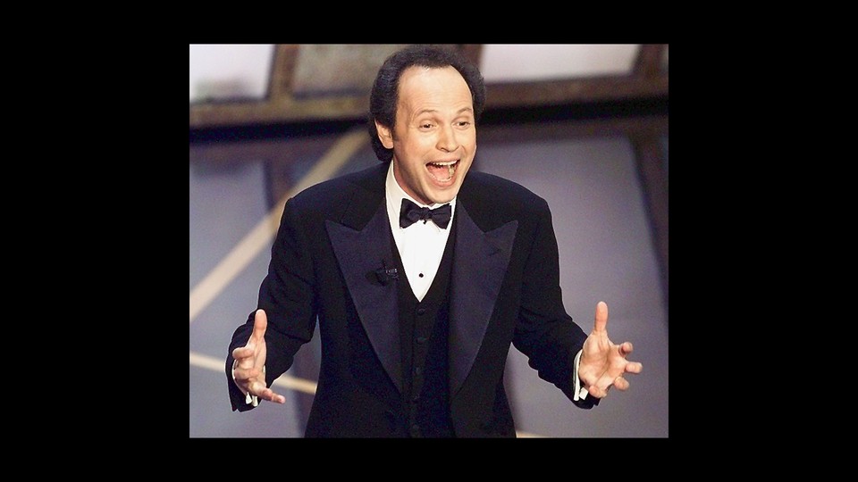 Billy Crystal onstage at the Oscars