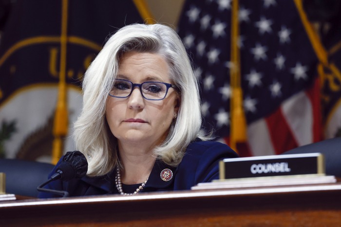 U.S. Rep. Liz Cheney in front of an American flag