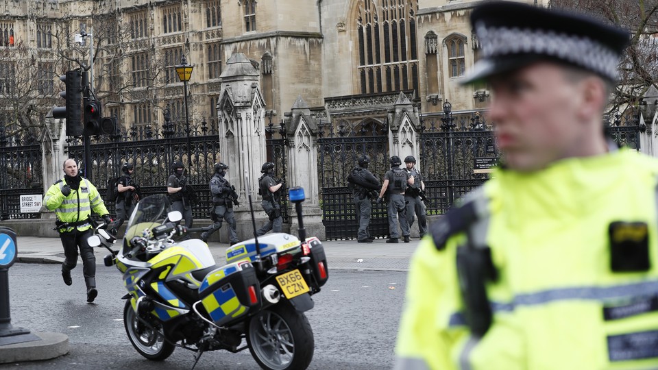 Armed police respond outside Parliament during an incident on Westminster Bridge in London, Britain March 22, 2017.