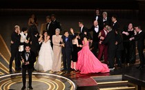 Jonathan Wang accepting the Best Picture Oscar for "Everything Everywhere All at Once," with the rest of the cast and crew behind him