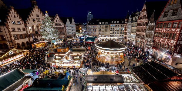 An elevated view of a brightly-lit Christmas marketplace.