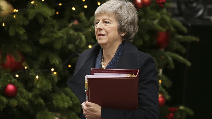 Theresa May leaves 10 Downing Street ahead of the no-confidence vote in Parliament.