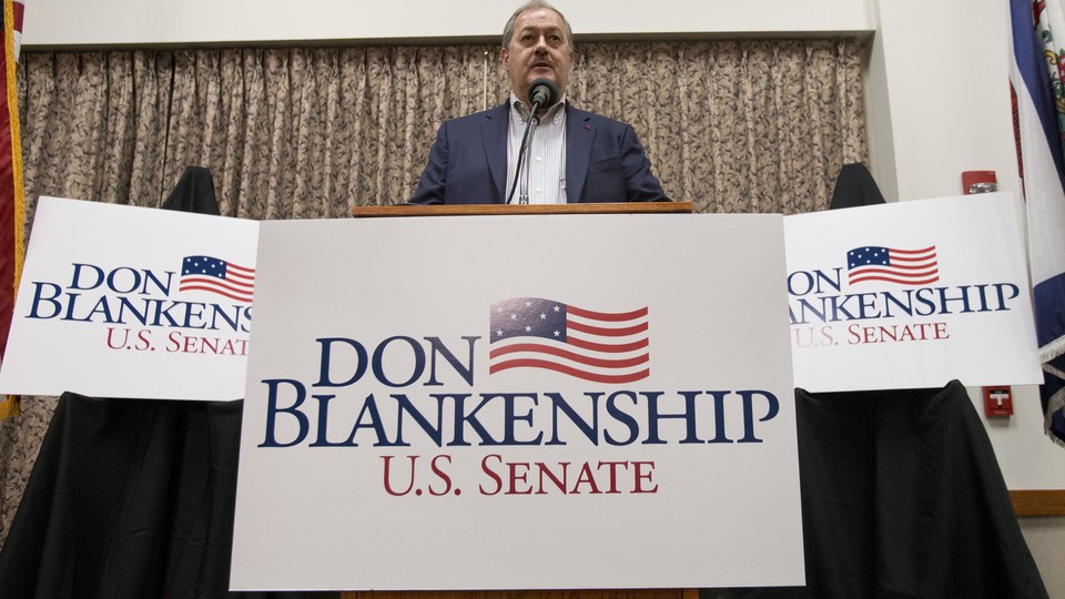 Don Blankenship, a Republican Senate candidate in West Virginia, surrounded by campaign signs.
