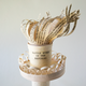 A paper sculpture of Lady Liberty's torch made of strips of the printed “Battle Hymn of the Republic,” with the lines of the poem forming the flames.