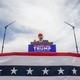 Donald Trump speaks from a podium during his campaign rally
