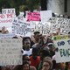 Demonstrators march through downtown Atlanta on July 8 to protest the shootings of black men by police officers.