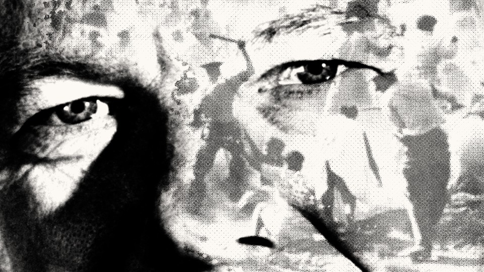 A close-up of a white apartheid leader's face on which scenes of apartheid-era violence are projected