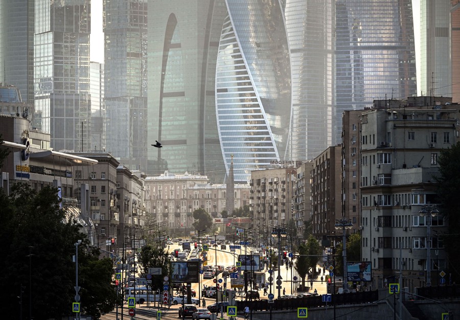 A view of a large street between the buildings of Moscow.