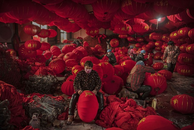 Chinese workers make traditional red lanterns at a local factory on January 24, 2019, in the village of Tuntou, Hebei province, China