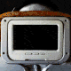 Animated gif of a screen on an airplane seat playing snippets of movies