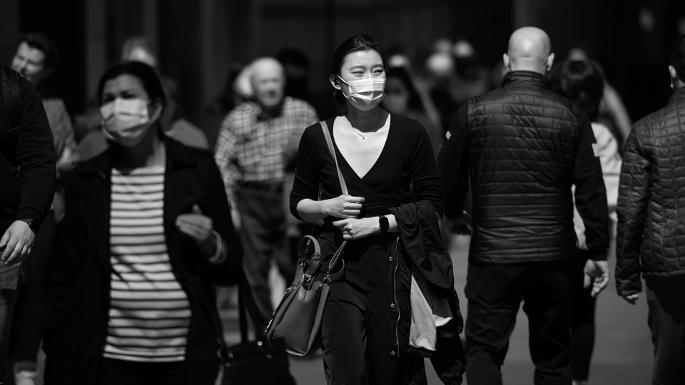 An image of a women wearing a mask