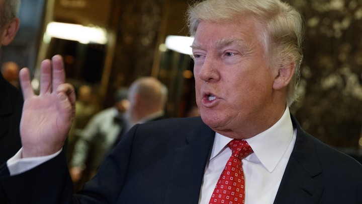 President-elect Donald Trump talks with reporters in Trump Tower in New York.