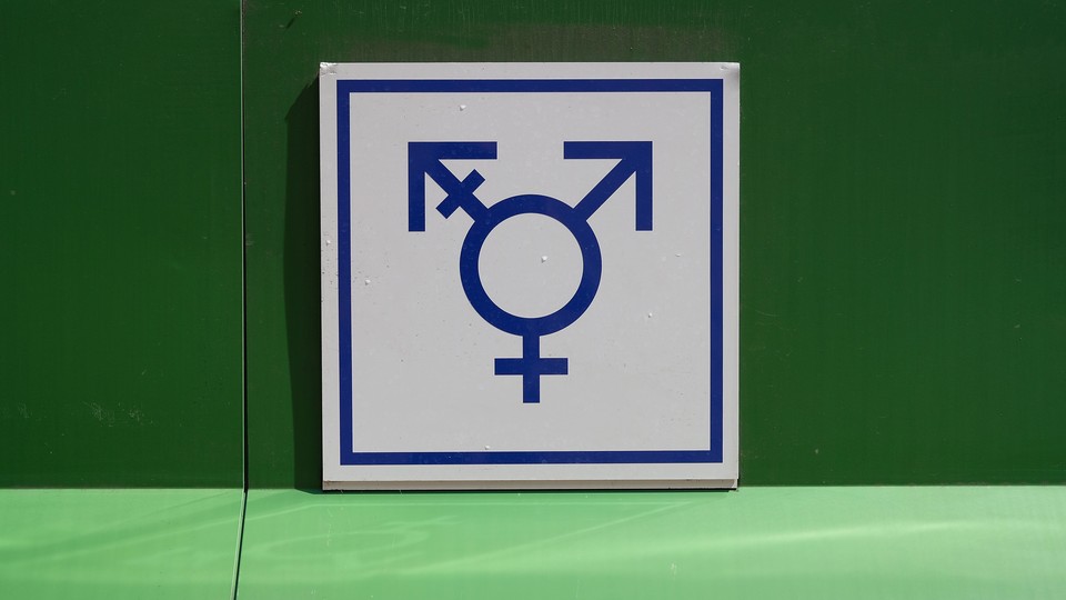 a sign for an all-gender bathroom