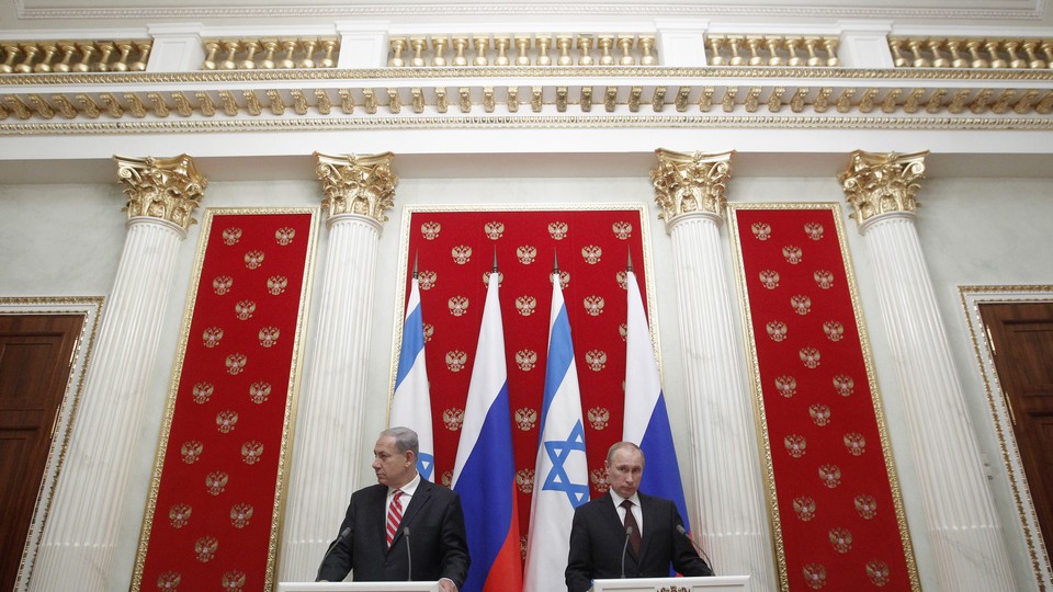 Russian President Vladimir Putin and Israeli Prime Minister Benjamin Netanyahu take part in a joint news conference in Moscow's Kremlin.