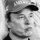Black-and-white photo of Elon Musk in a campaign cap