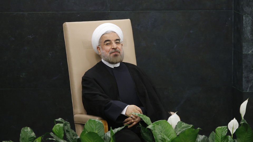 Iranian President Hassan Rouhani sits before addressing the 2013 UN General Assembly