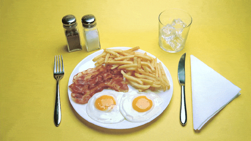 A GIF of a breakfast plate being taken away.