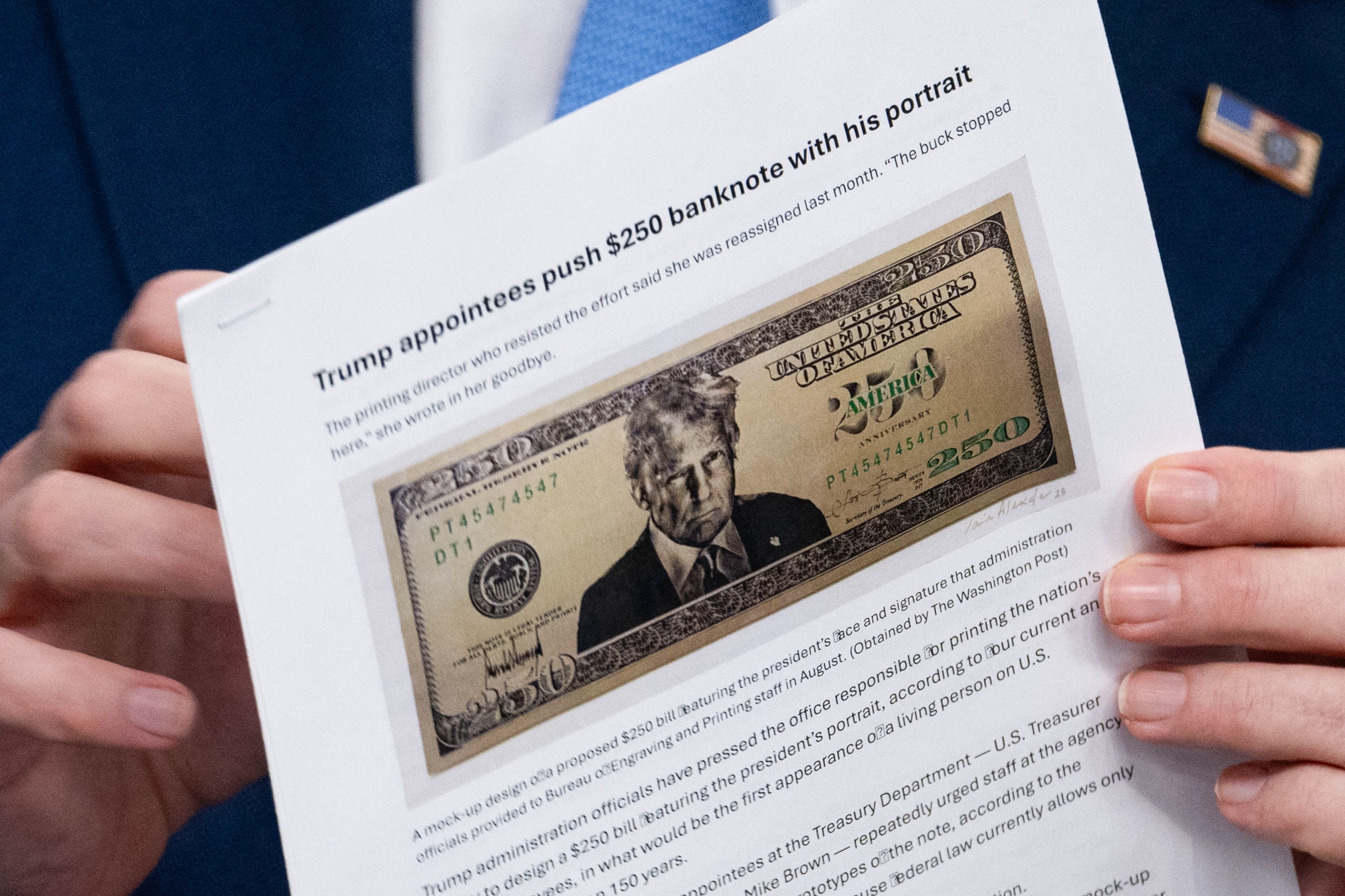 a printed paper with a drawing of a $250 Donald Trump bill