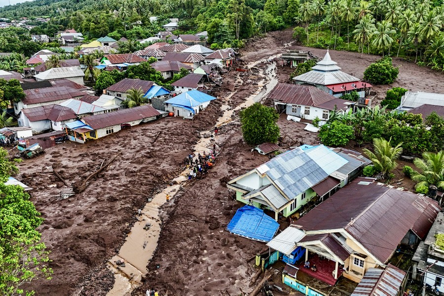 An aerial view of many houses half-buried in a mud flow