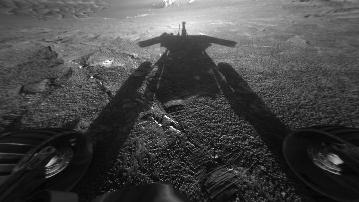 The Opportunity rover photographs its shadow on Mars.