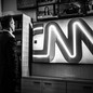 Chris Licht next to a CNN sign