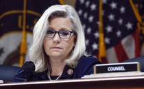 U.S. Rep. Liz Cheney in front of an American flag