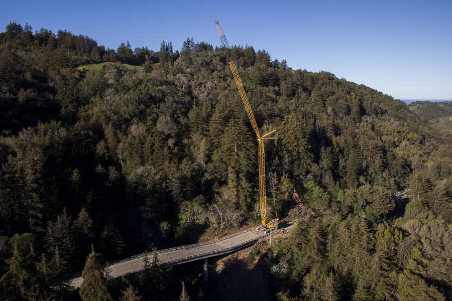 A crane sits on Highway 1 south of the Pfeiffer Canyon Bridge in Big Sur, California, on March 13, 2017.