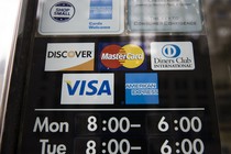 A sign with the logos of various credit-card companies