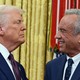 Robert F. Kennedy Jr., smiles and shakes hands with Donald Trump after a swearing-in ceremony
