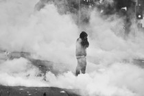 A new photo of a protester in L.A. amid tear-gas clouds