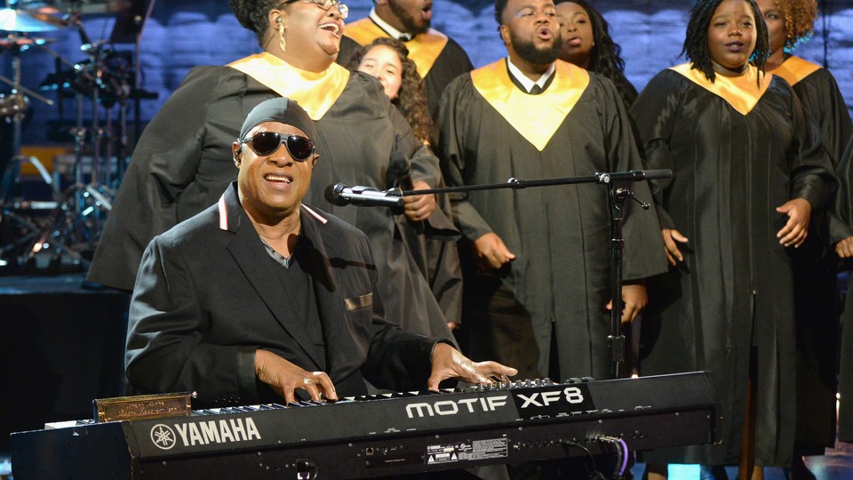 Stevie Wonder performs "Lean on Me" during Hand in Hand