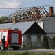 Firefighters work at a damaged home in Wyryki, a village in Poland, after Russian drones violated Poland's airspace.