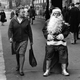 Lady looking at a shabby Santa
