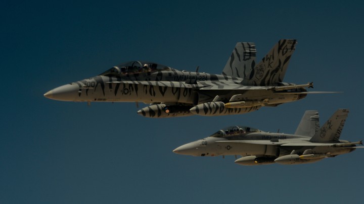 Two U.S. Marine Corps F-18 Super Hornets depart after receiving fuel from a 908th Expeditionary Air Refueling Squadron KC-10 Extender during a flight in support of Operation Inherent Resolve on May 31, 2017.