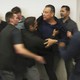 An image of Alex Padilla being forcibly removed