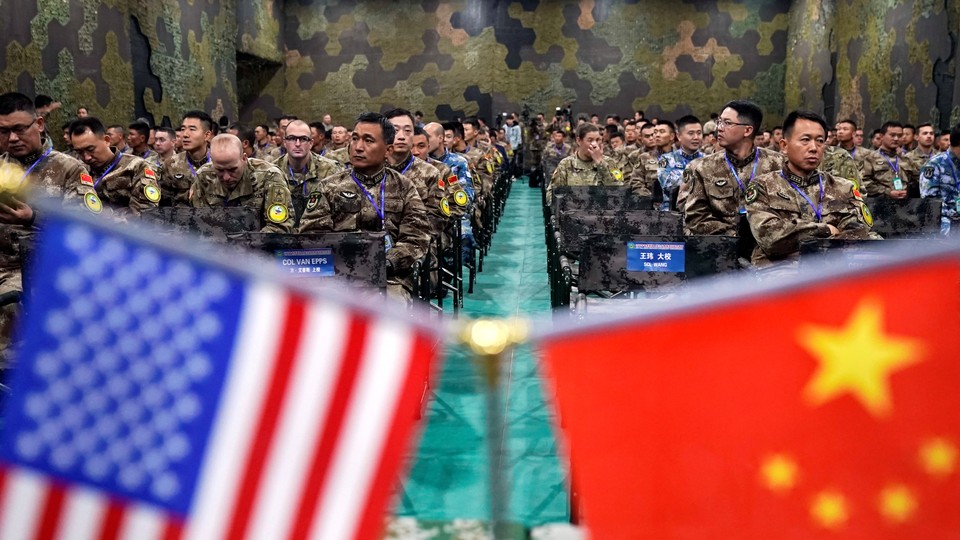 Personnel from the U.S. Army and the People's Liberation Army attend a closing ceremony of a "Disaster Management Exchange" near Nanjing, China, on November 17, 2018.