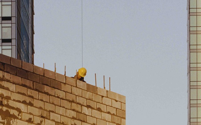 A construction worker atop a building in NYC