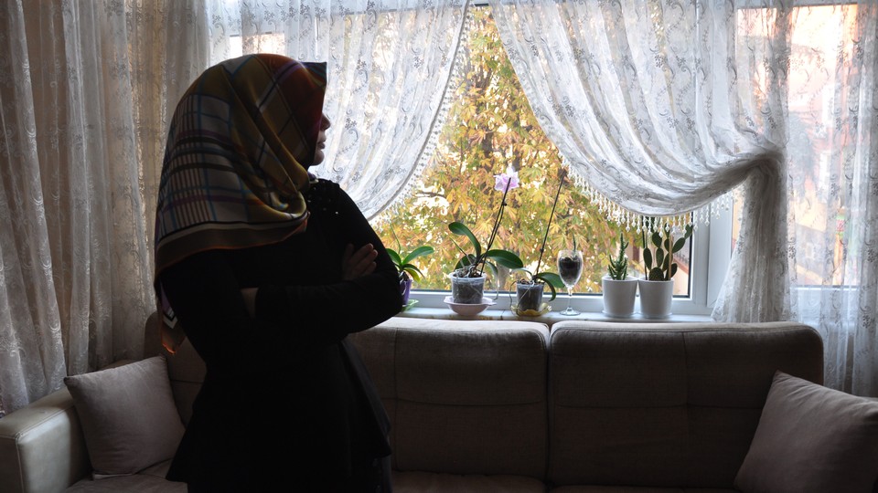 A 28-year-old Gulenist teacher who lost her job after the coup waits in her home in Turkey