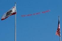 A plane flies over the Stanford stadium trailing a banner calling for the dismissal of the judge in the Stanford rape case prior to the Stanford University commencement ceremony in June.