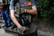 A member of a militia stands near a rally in Charlottesville, Virginia, August 12, 2017. 