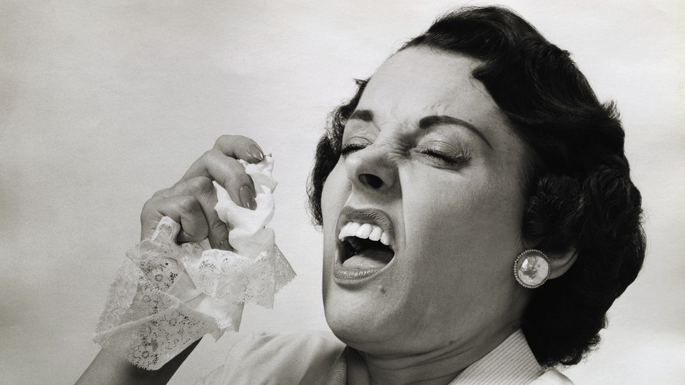 A woman about to sneeze