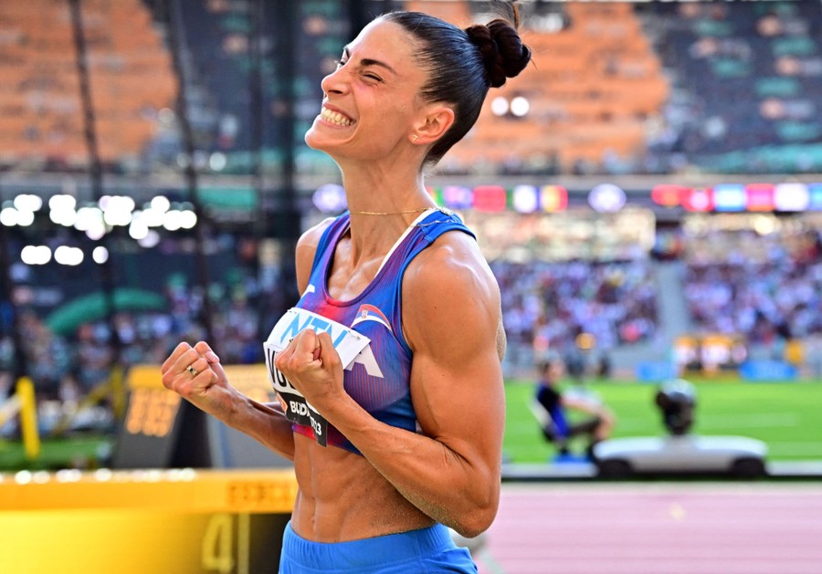 An athlete reacts joyfully after winning an event.