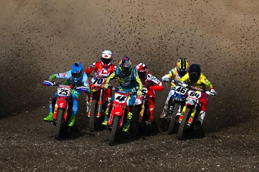 Six motorcycle racers ride toward the camera.