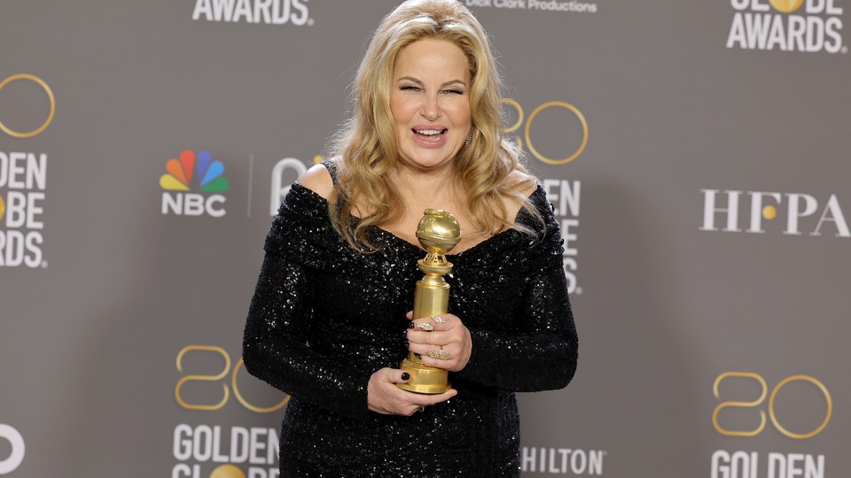 Jennifer Coolidge poses with the award for Best Supporting Actress in television at the Golden Globes.